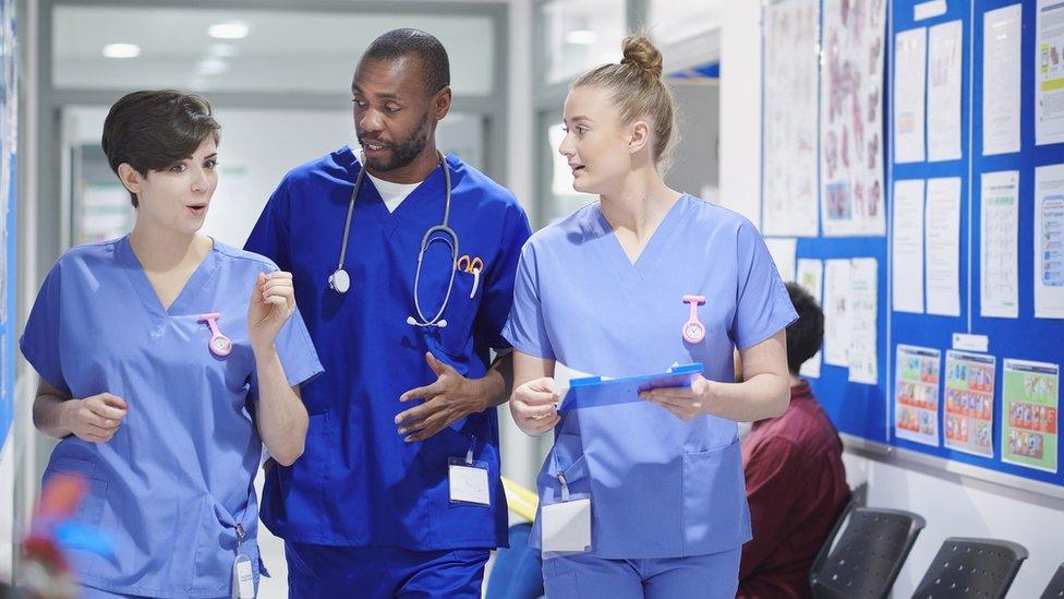 Stock photo of a consultant and two nurses in a hospital