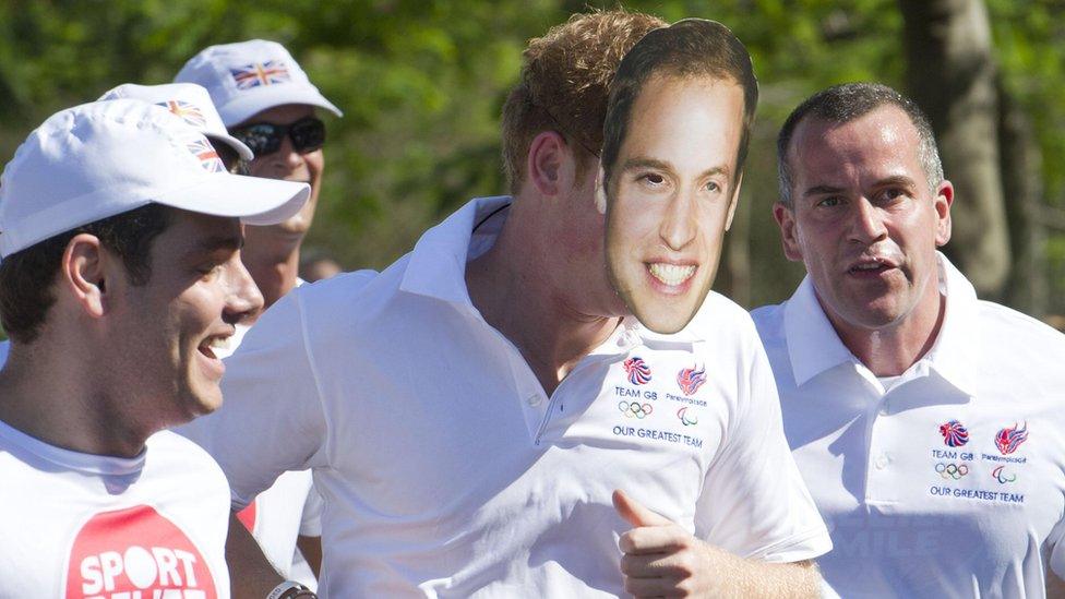 Prince Harry wears a Prince William mask.