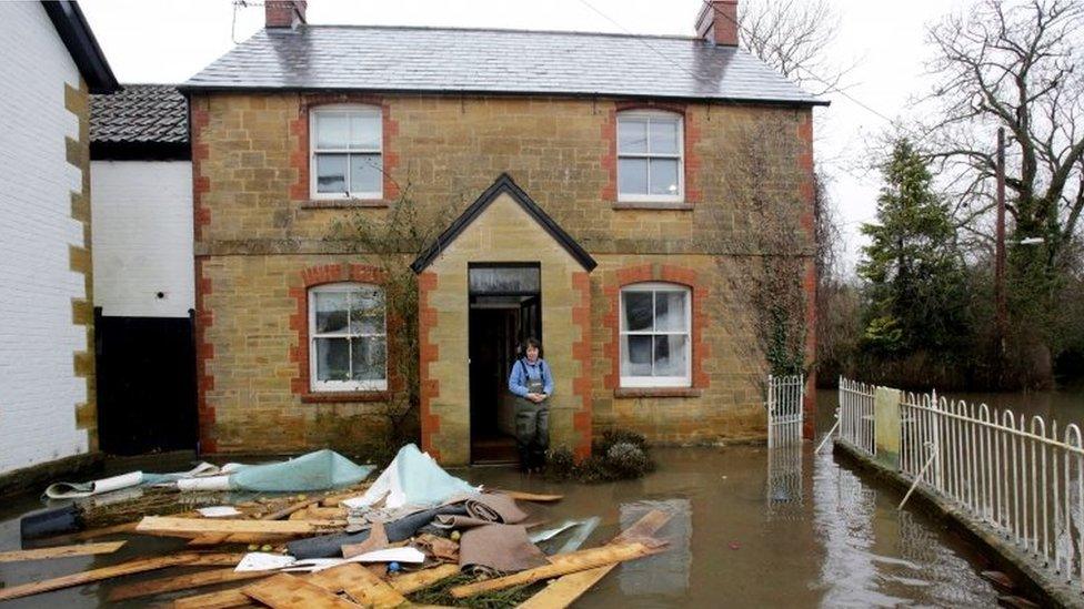 Holly Baillie-Grohman looks at flood damage in the village of Thorney, in Somerset