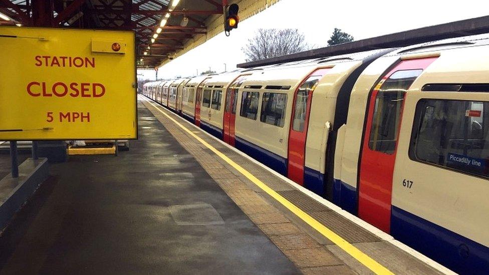 An empty Piccadilly line train stopped at Stamford Brook underground station