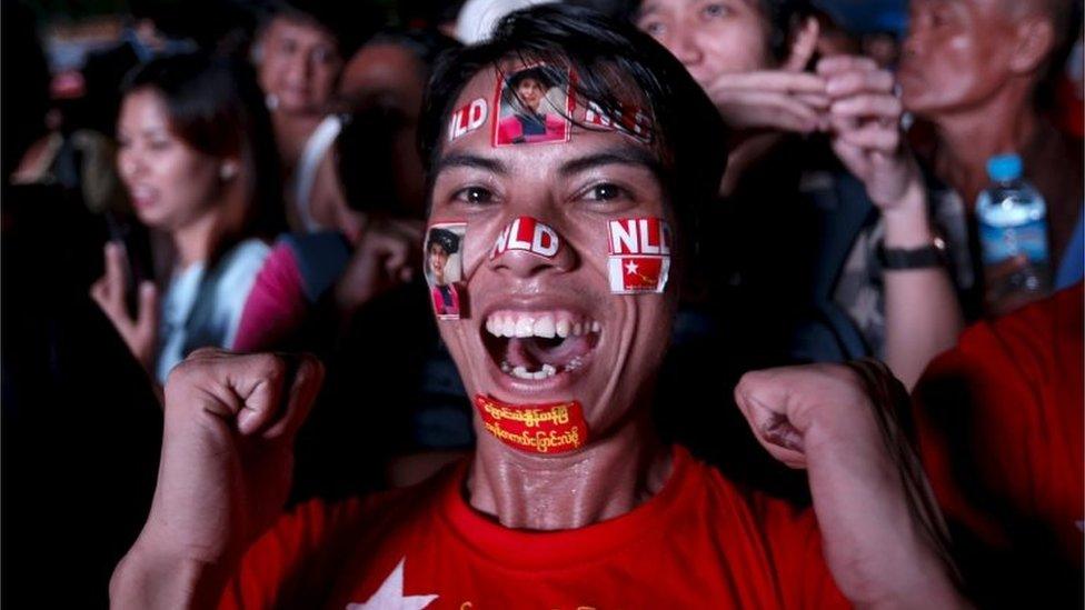 An NLD supporter celebrates the election win in Yangon (9 Nov 2015)