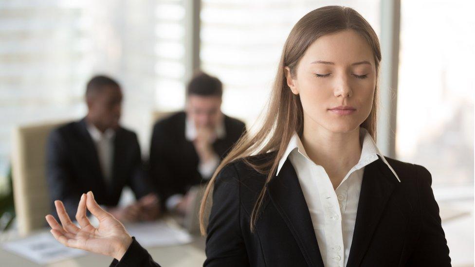 Woman trying to keep calm in office after interview