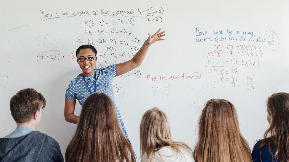 Maths teacher teaching a class