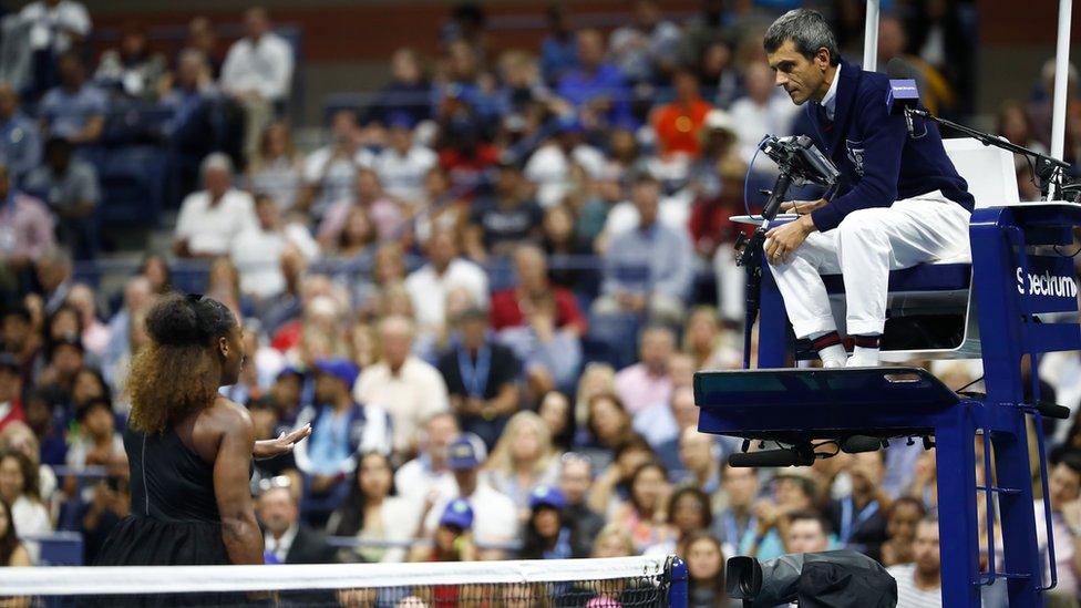 Serena Williams of the United States discusses a coaching violation warning given by umpire Carlos Ramos during her Women's Singles finals match against Naomi Osaka of Japan on Day Thirteen of the 2018 US Open at the USTA Billie Jean King National Tennis Center on September 8, 2018 in the Flushing neighborhood of the Queens borough of New York City