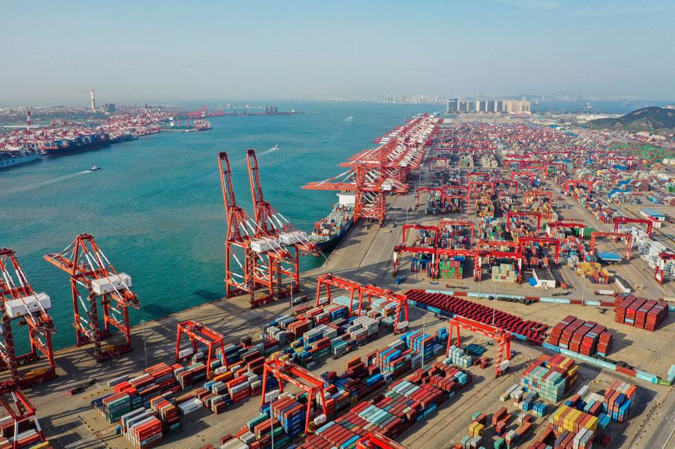 Aerial view of containers sitting stacked at Qingdao Port on 28 May, 2019 in Qingdao