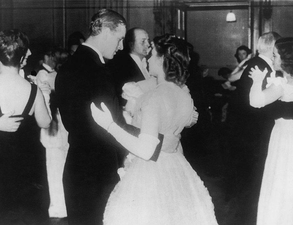 Princess Elizabeth dances with her fiance, Philip Mountbatten, in public for the first time at a ball at the Assembly Rooms, Edinburgh, in July 1947