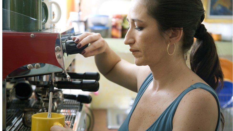 Worker at coffee machine