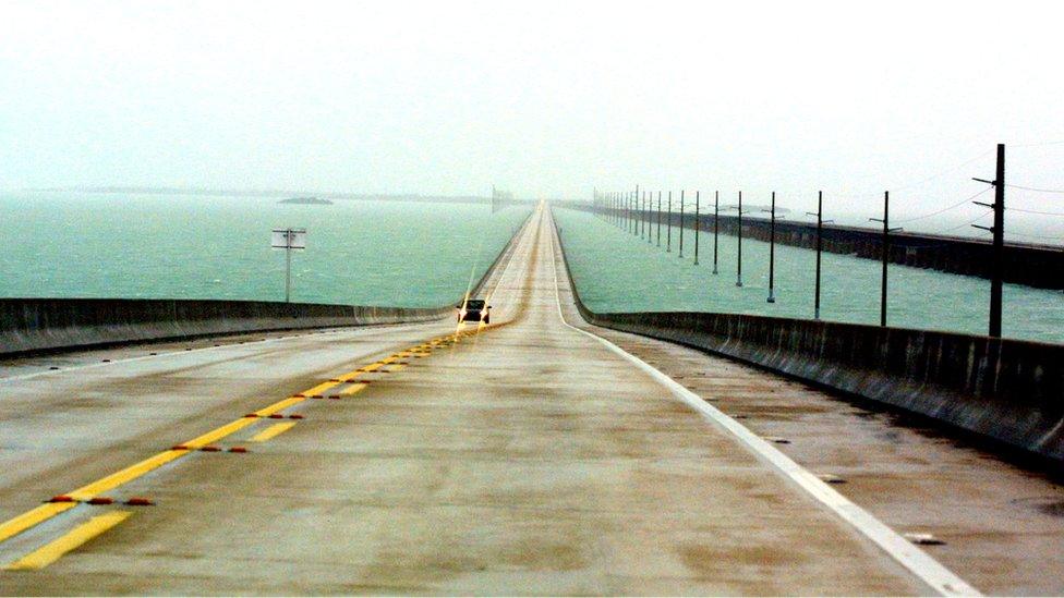 A car drives on seven mile bridge in 2001