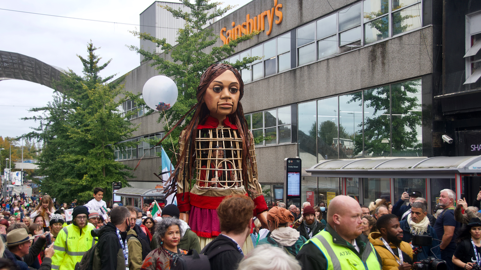 Large crowds follow Little Amal