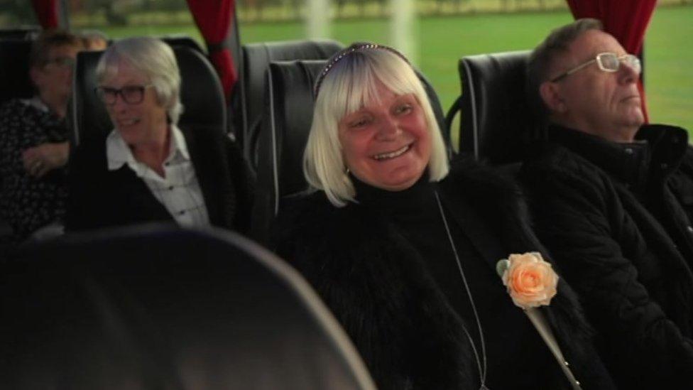 A passenger smiling