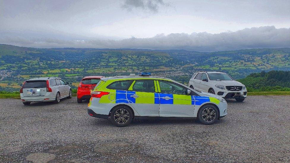 Police vehicle near Sugar Loaf Mountain