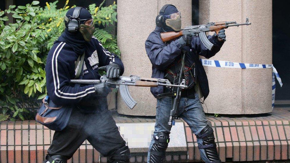 Firearms instructors play the role of terrorists during a Metropolitan Police training programme for armed officers when responding to a terrorist firearms attack.