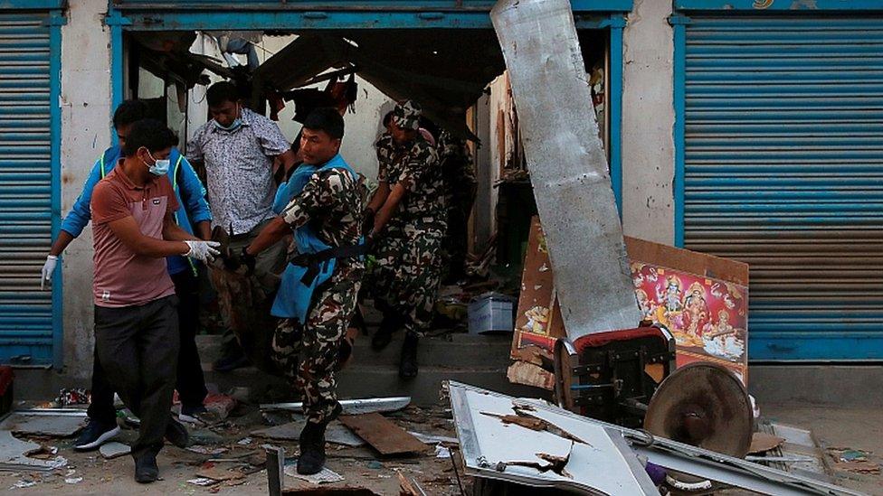 Security personnel remove a victim after an explosion in Kathmandu, Nepal May 26, 2019