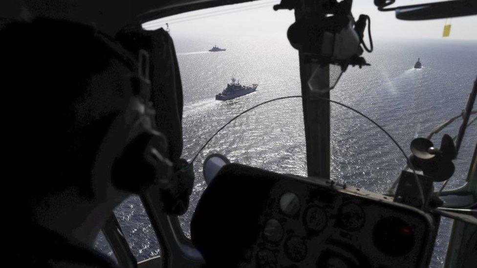 Russian navy ships are viewed through a military helicopter's window during military drills at the Black Sea coast, Crimea (09 September 2016)