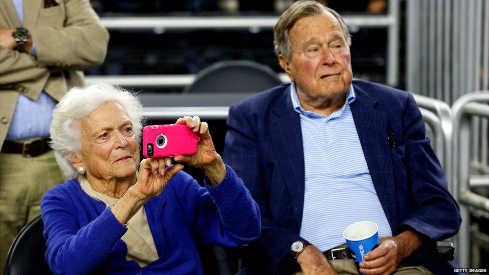 Former President George HW Bush and his wife Barbara Bush watch the 2015 NCAA Men's Basketball Tournament in Houston, Texas - March 29, 2015