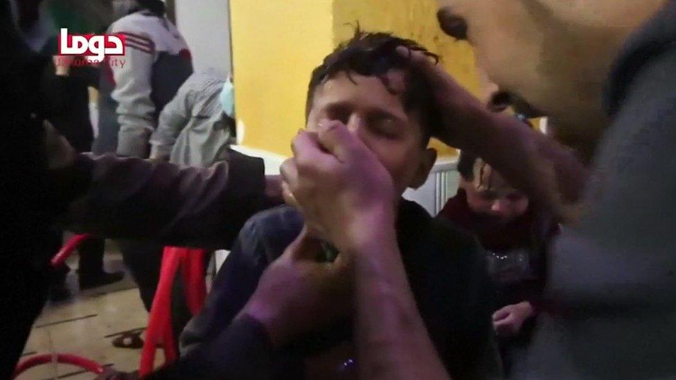 A boy is given an inhaler after a chemical attack