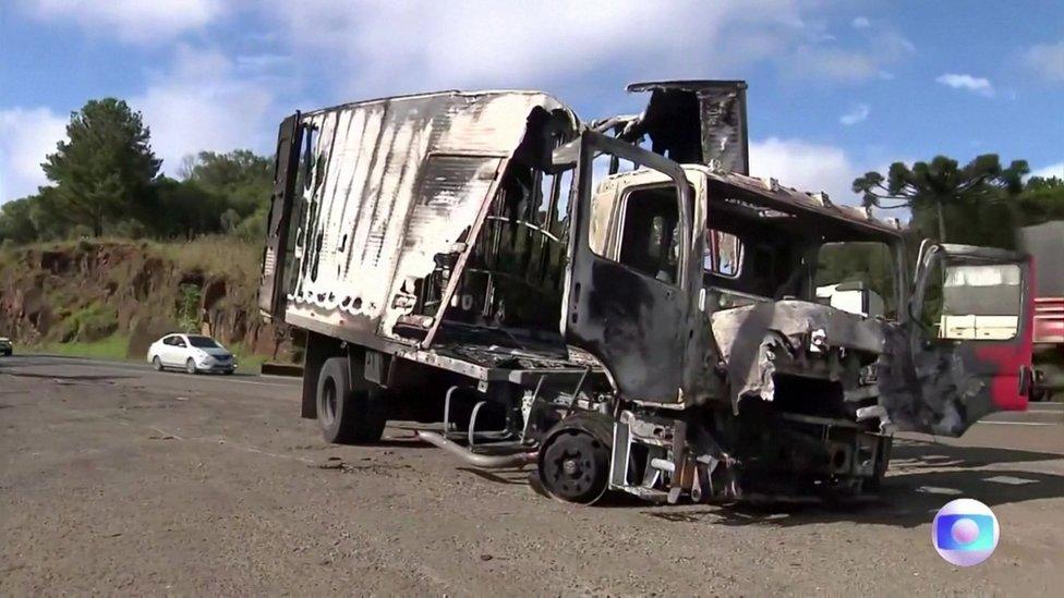 View of burned out vehicle on the outskirts of Guarapuava