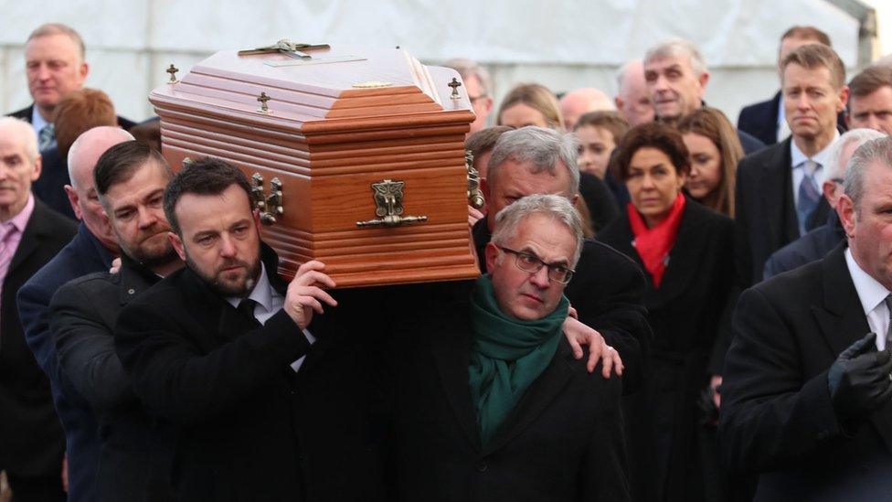 Colum Eastwood (front left) and Alex Attwood (front right) carry the coffin of Seamus Mallon