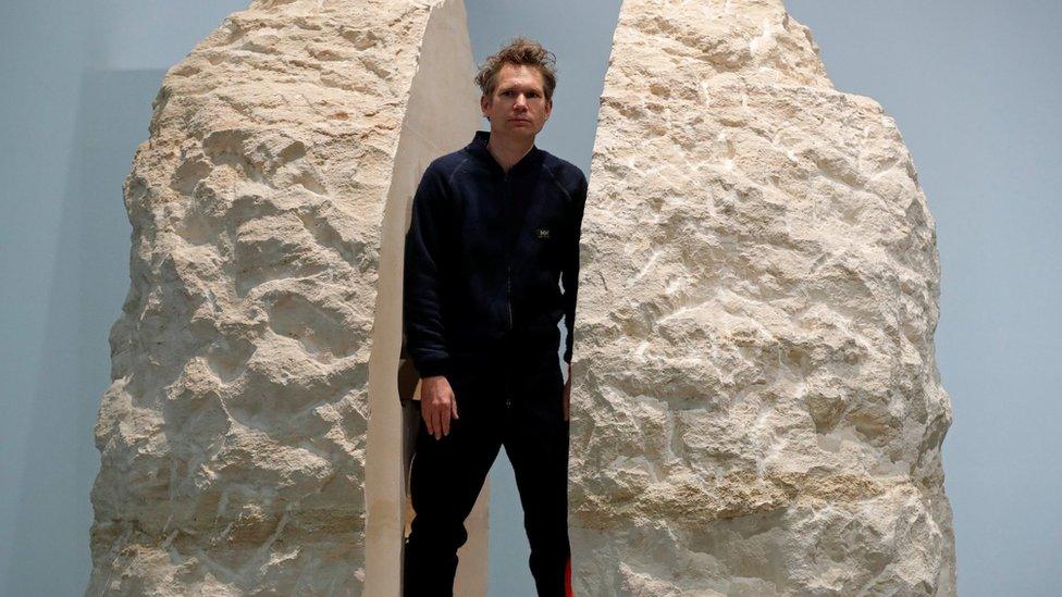 French artist Abraham Poincheval poses inside his artwork Pierre ("Stone") in Paris, France, on 22 February 2017, before entering the rock as part of his project to live inside for a week