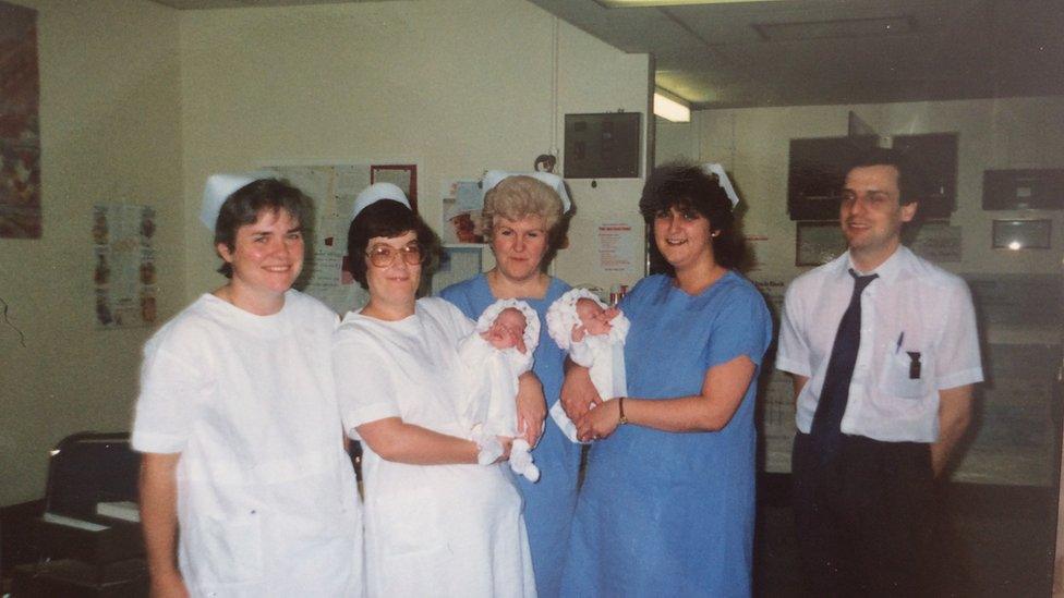 Medical staff with two of the triplets