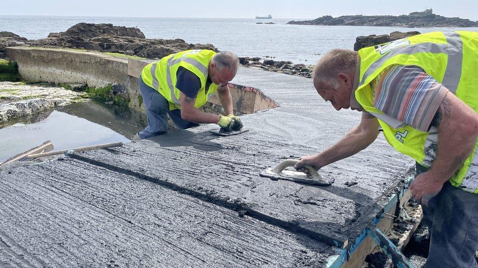 New concrete walkway being laid