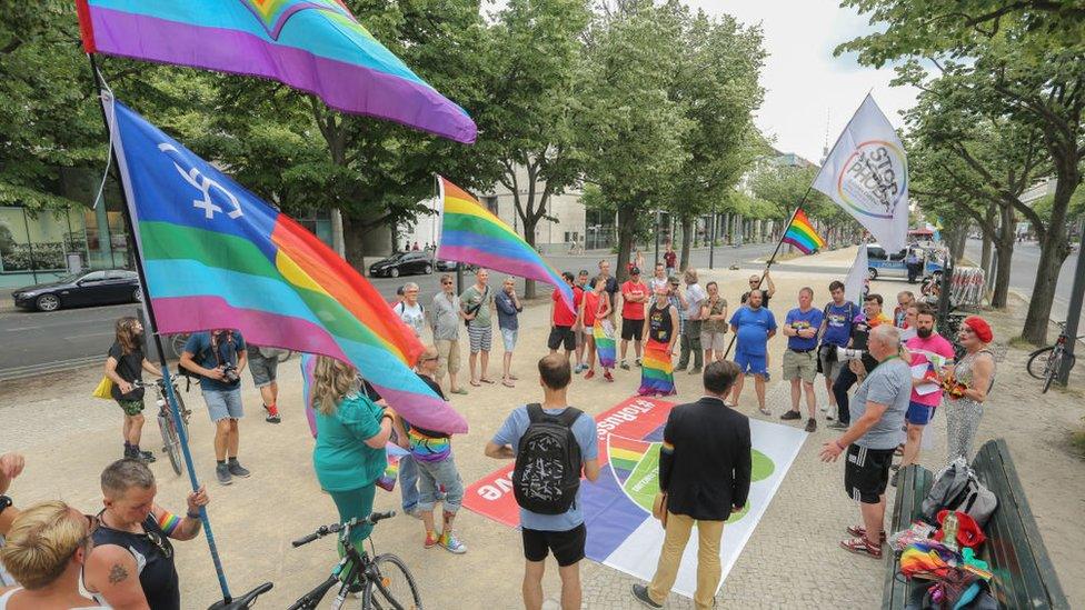 Followers of the QFC, Queer Football Fanclubs, community attend a gathering to remember the current situation of the LGBT, Lesbian, Gay, Bisexual, Transgender, people in Russia at the Russian embassy on June 10, 2018 in Berlin, Germany.