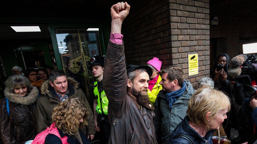 A member of the Stansted 15 leaves court