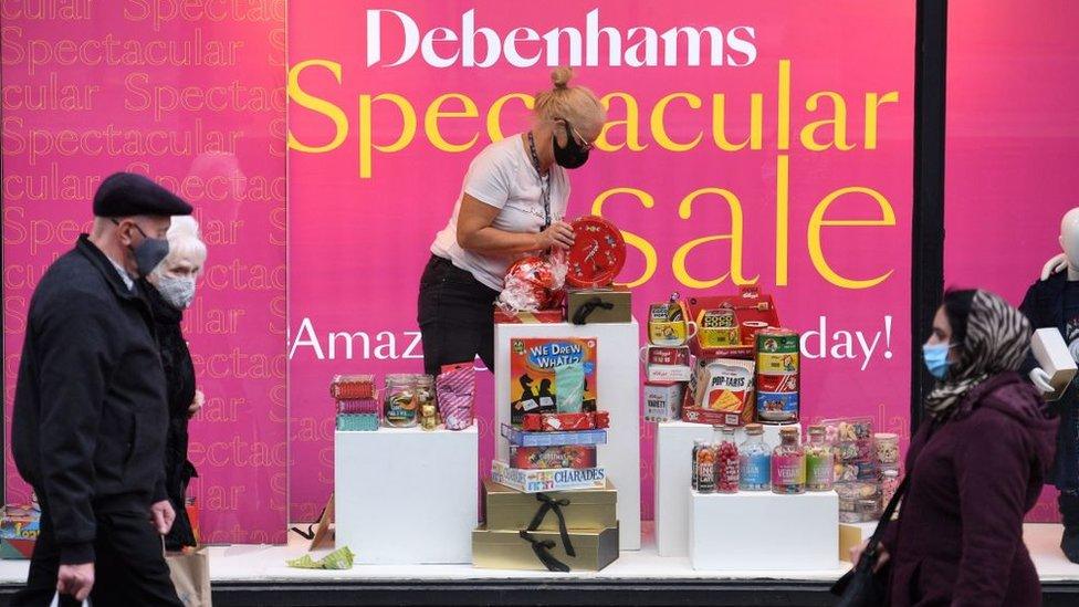 Worker creates window display