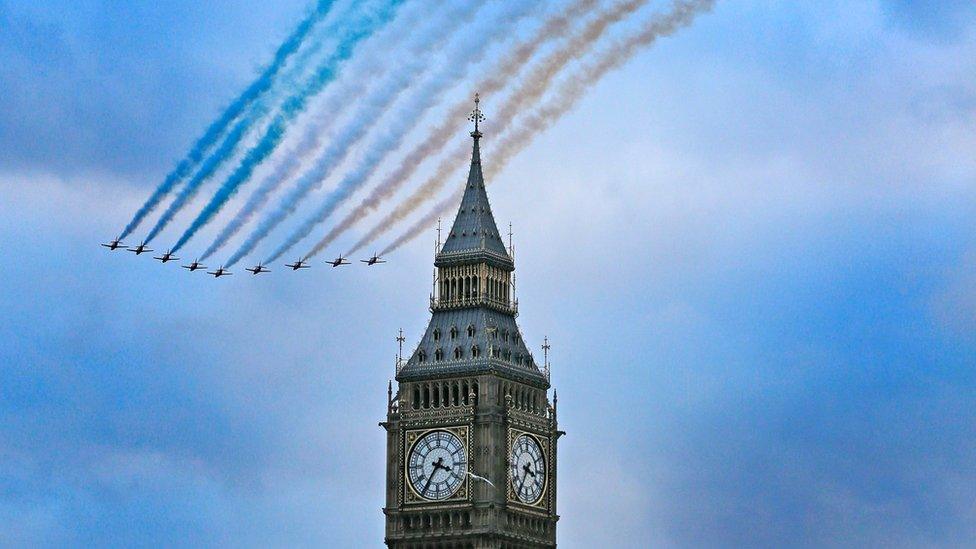 The RAF Red Arrows fly in formation past Big Ben in London