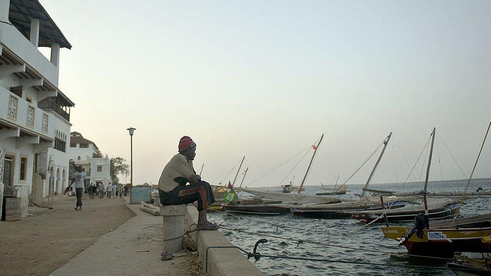 fisherman seated at a moor in Kenya's resort-island of Lamu, over 800 kilometres south-east of Nairobi