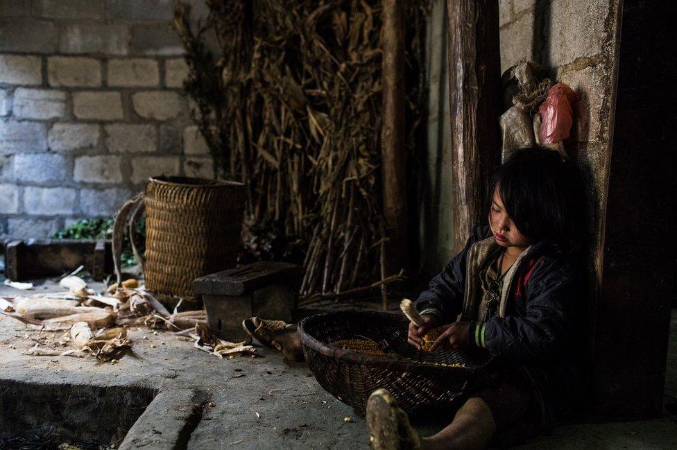 A small child prepares food