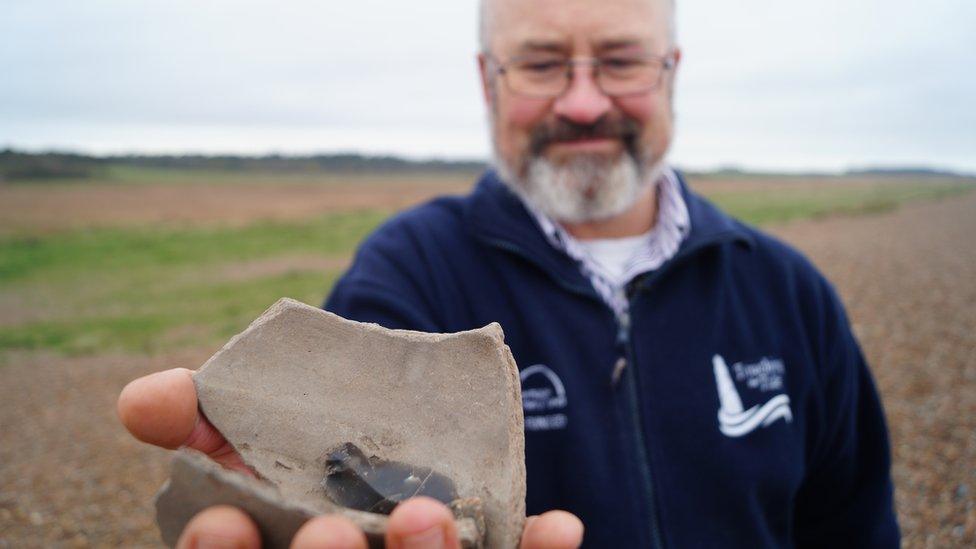 Bill Jenman with pottery from Dunwich