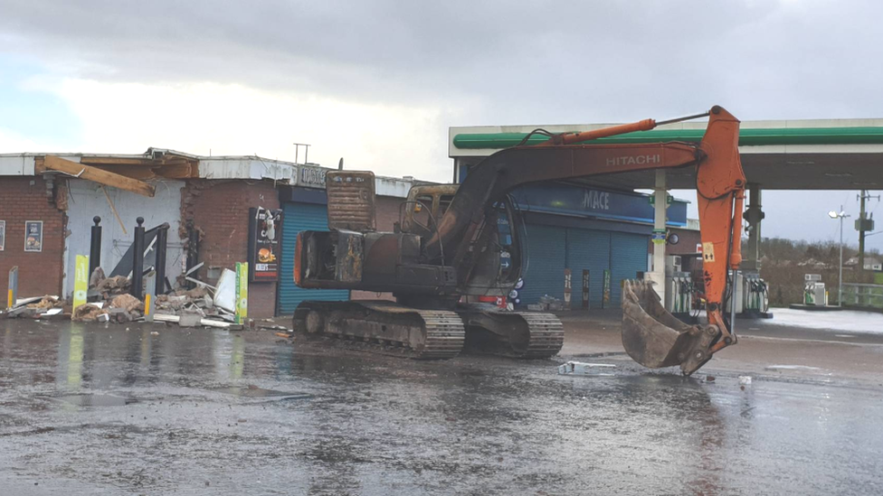 A digger was used to steal an ATM machine from a filling station wall