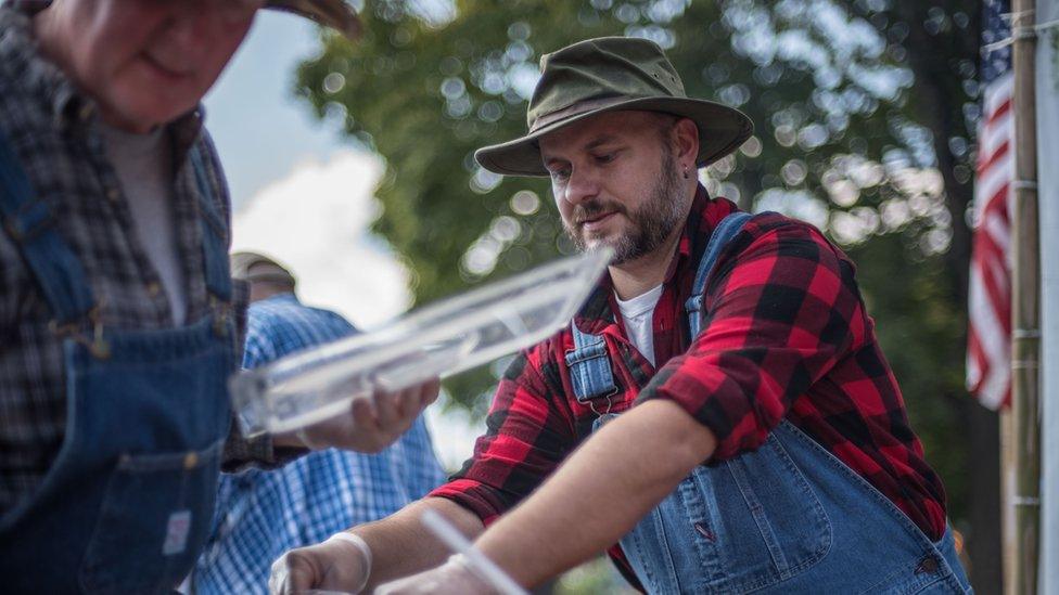 Cooking at the roadkill festival.