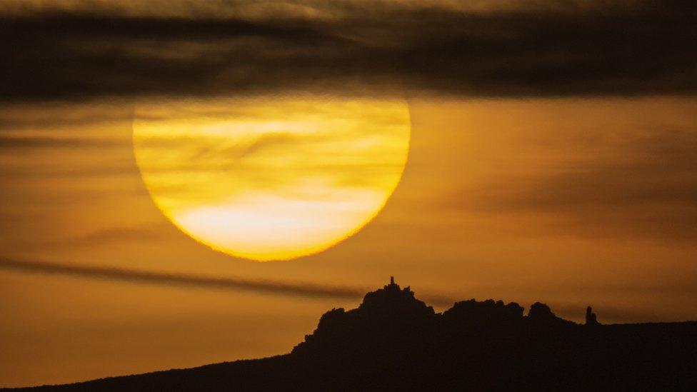 Sun setting behind Manstone Rock