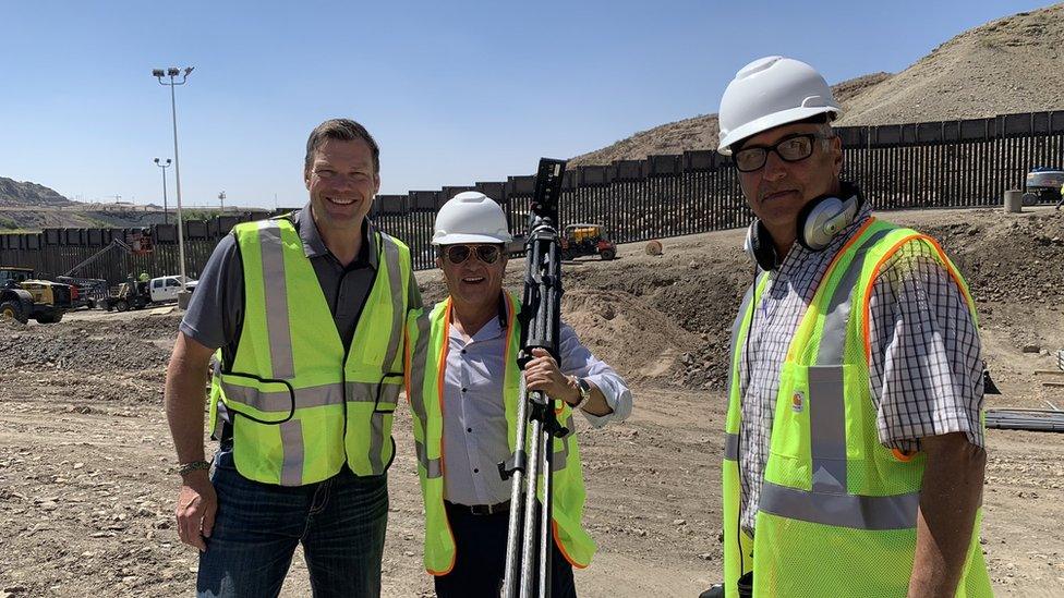 Former Kansas secretary of state Kris Kobach (left) giving tour of construction site