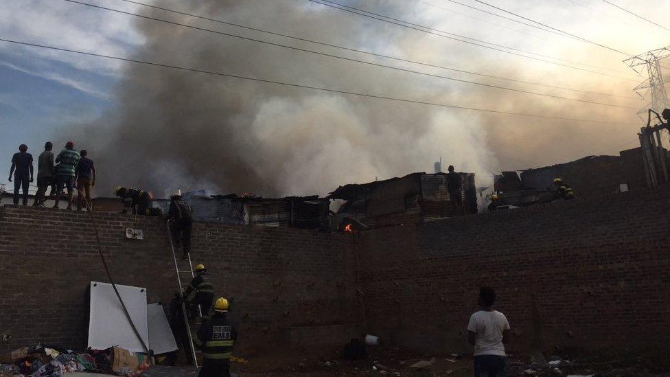 Emergency workers pictured at the site of the fire