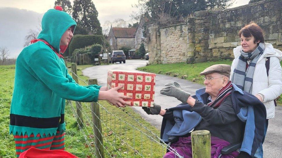 Oscar delivering gifts