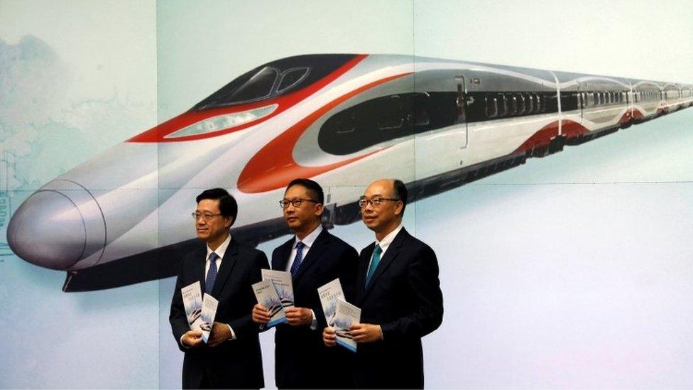 Hong Kong officials at media event about train station (25 July 2017)