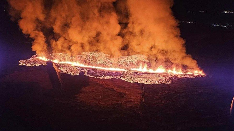 Volcano lava spill at night