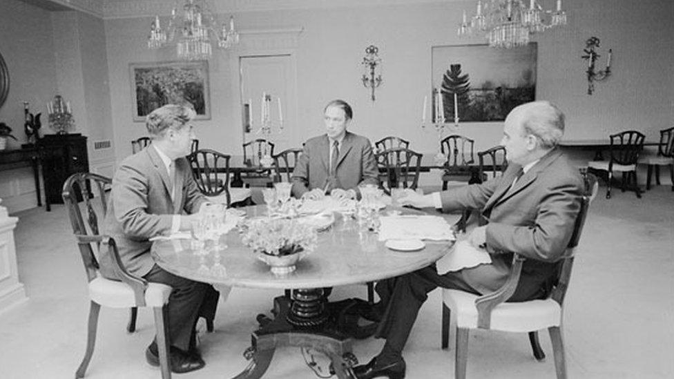 Prime Minister Pierre Elliott Trudeau, with two aides, at a working lunch at 24 Sussex Drive