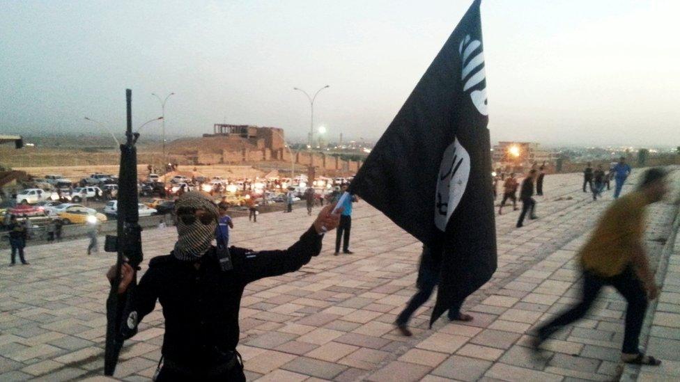 An IS fighter in Mosul, 23 June 2014