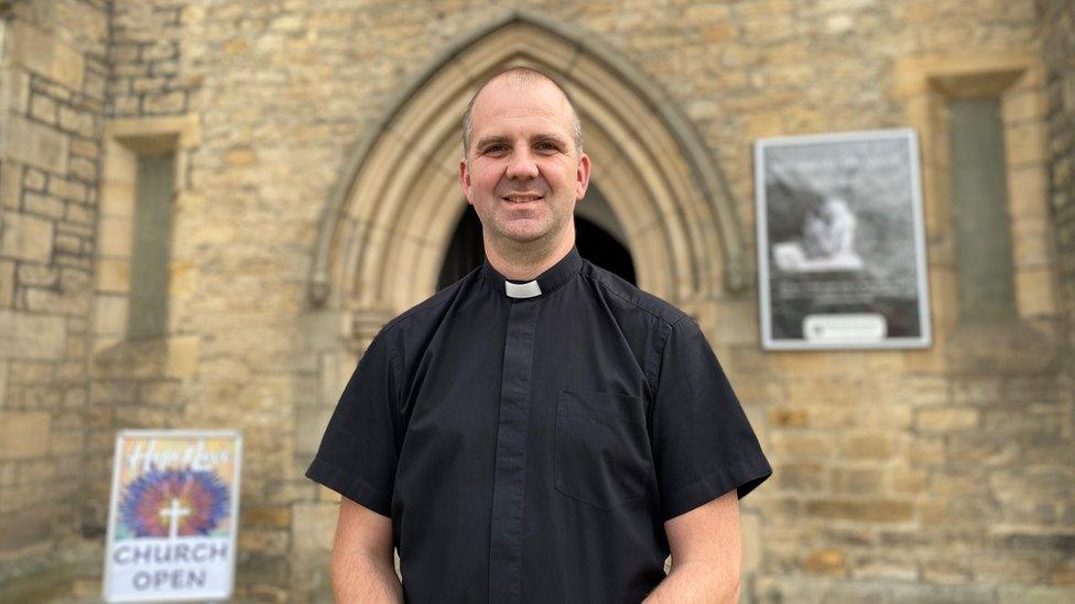 Matt standing outside the church