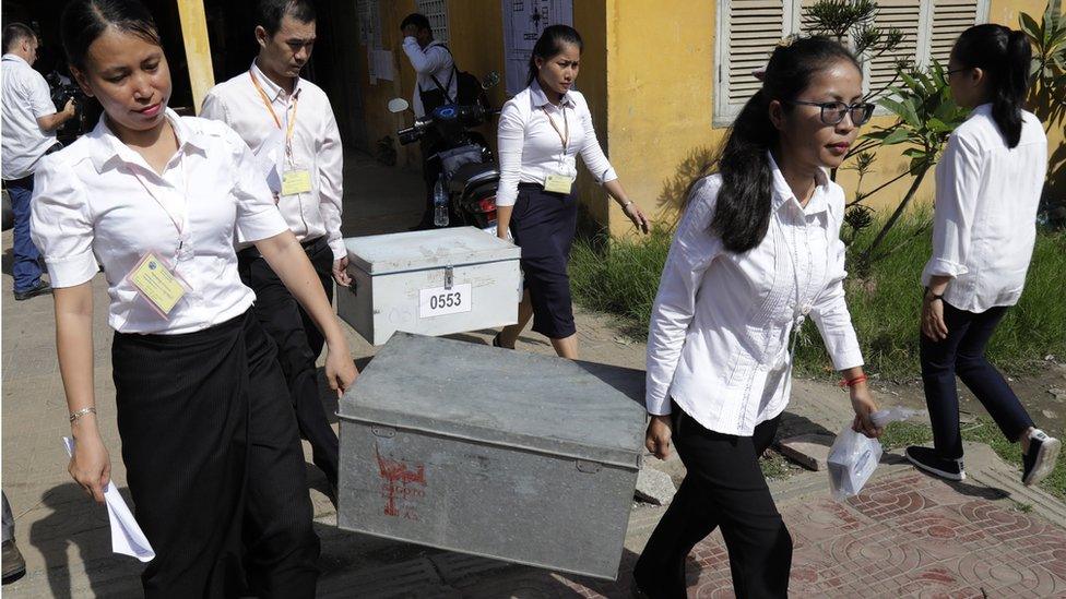 Cambodian National Election Committee (NEC) officials carry election boxes as they prepare for national elections in Phnom Penh, Cambodia, 28 July 2018