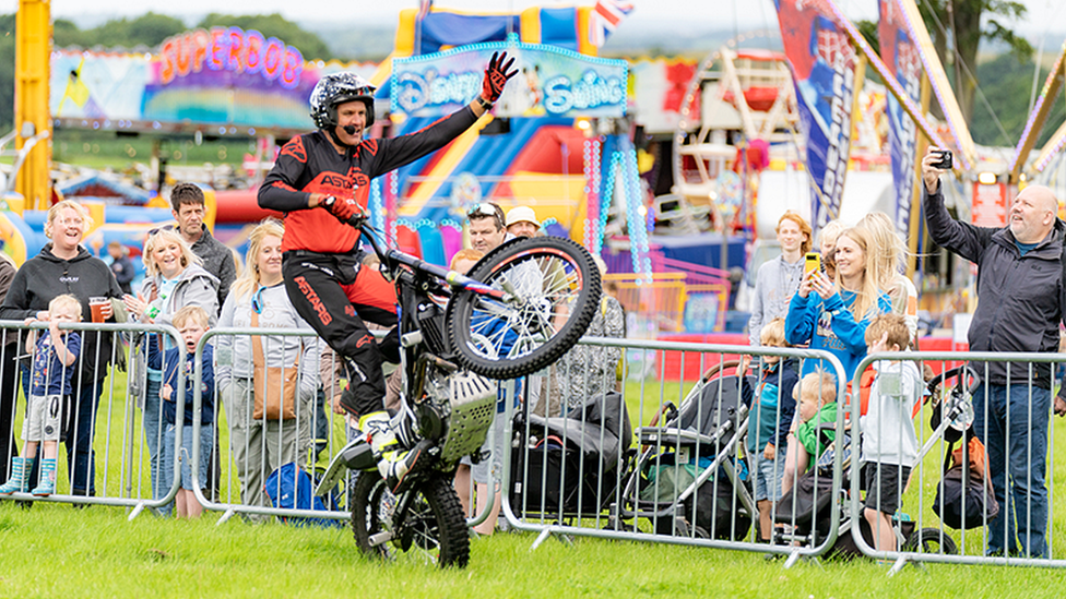 motorbike rider performs for spectators