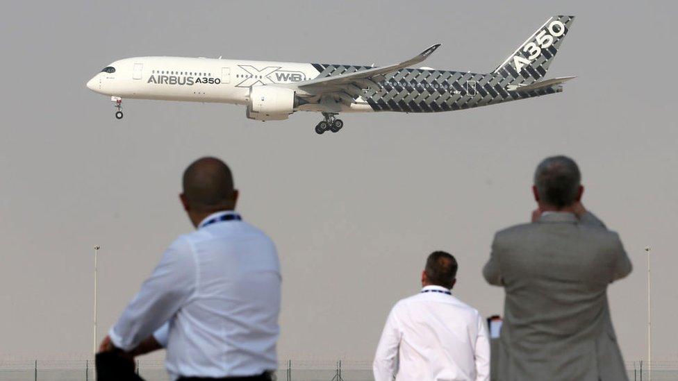 An Airbus A350 performs a flight display during the Dubai Airshow on November 12, 2017,