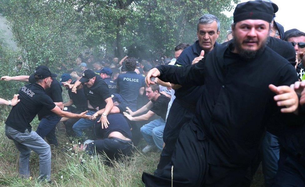 Police tackling protesters at LGBT event, 8 Jul 23