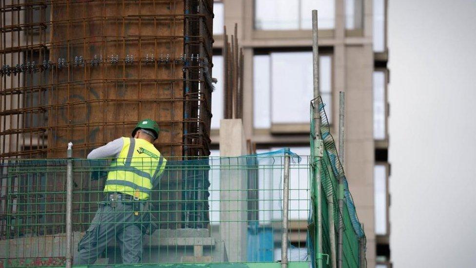 A construction worker on a building site near South Bank, London