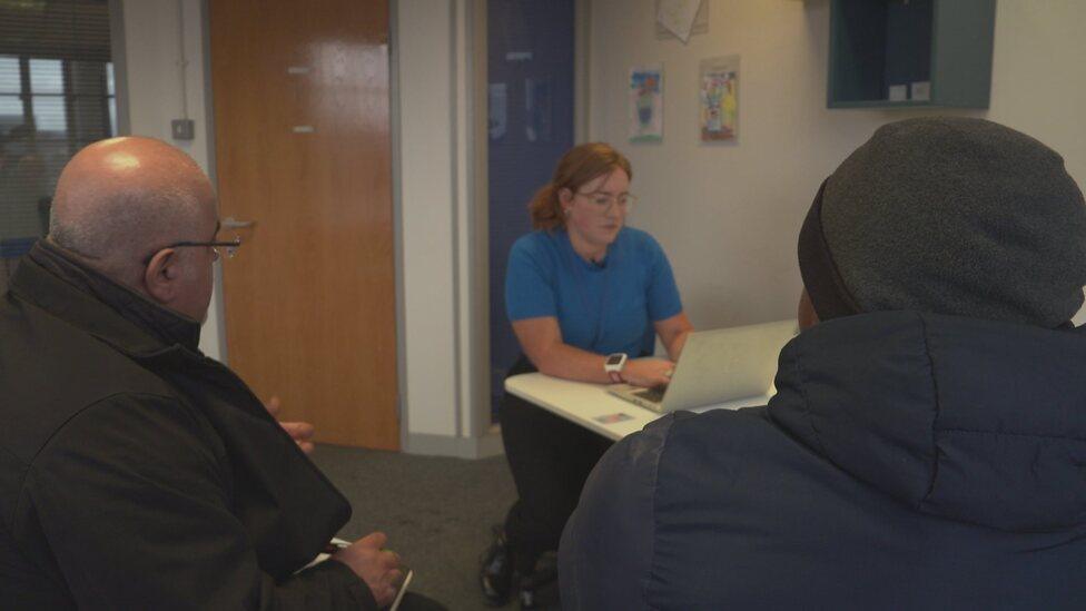 Mohammed (right) during his consultation with Robyn Dunbar-Smith of the Scottish Refugee Council and an interpreter (left)