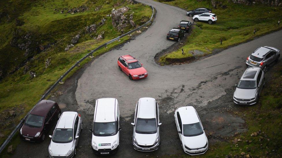 Tourists’ cars parked at the Quiraing